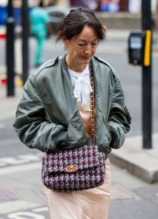 Stylish London woman wearing a bomber jacket