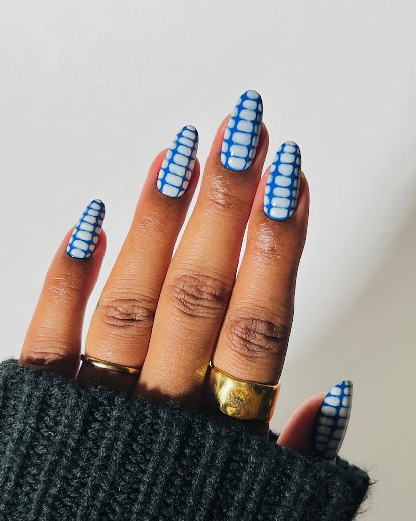 Try blue crocodile print nails for Sagittarius season 2024.