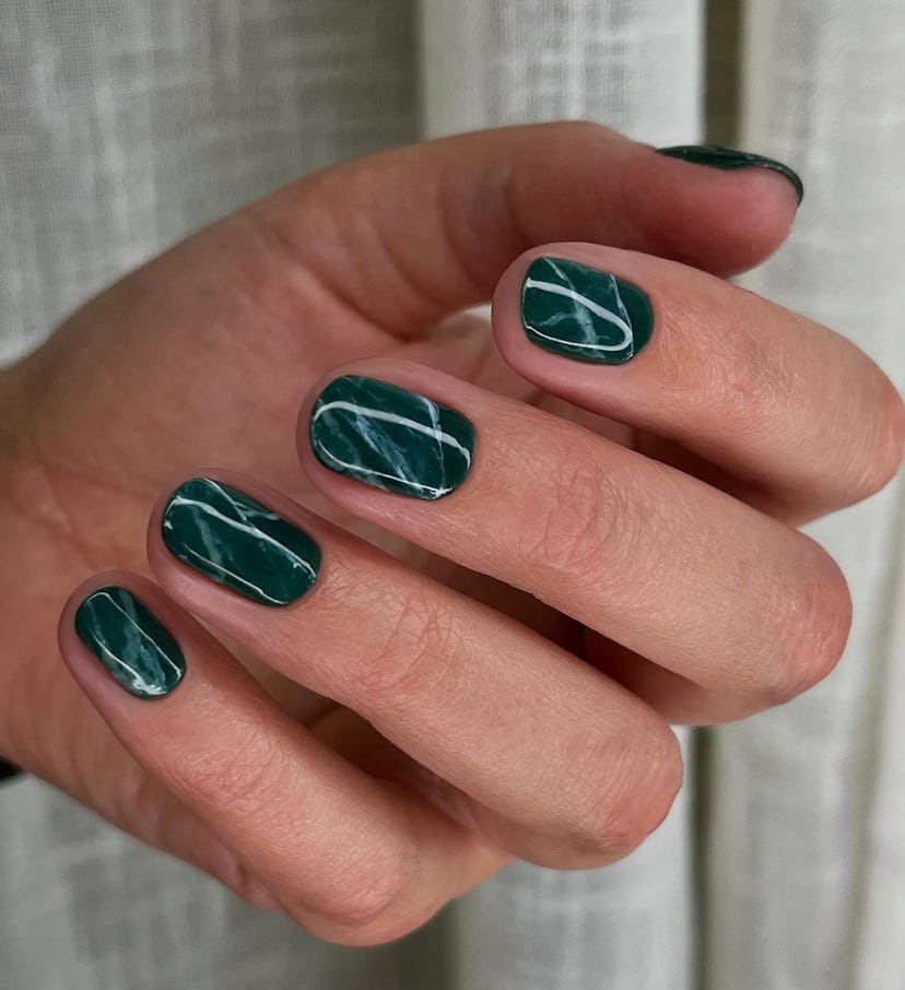 Try emerald marbled nails.