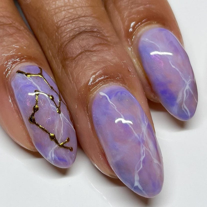 Try nails with the sign's constellation for Sagittarius season 2024.