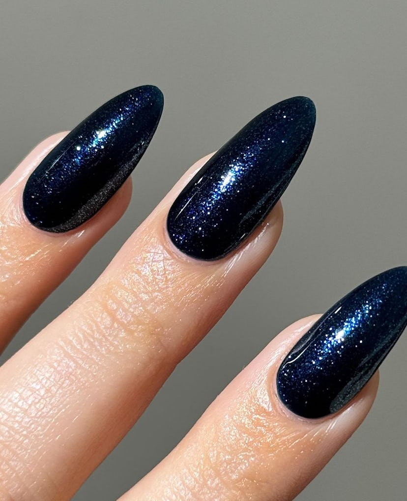 Try sapphire blue glitter nails for Sagittarius season 2024.