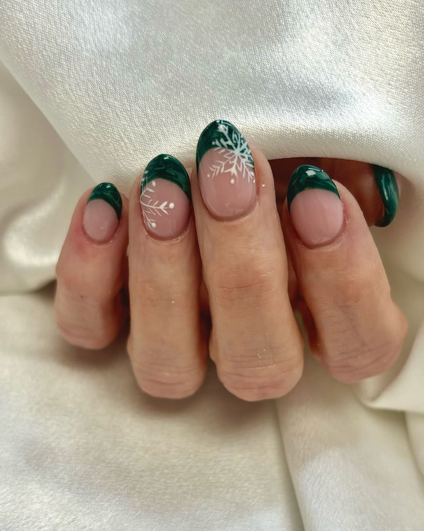 Try emerald French tip nails with snowflake designs.