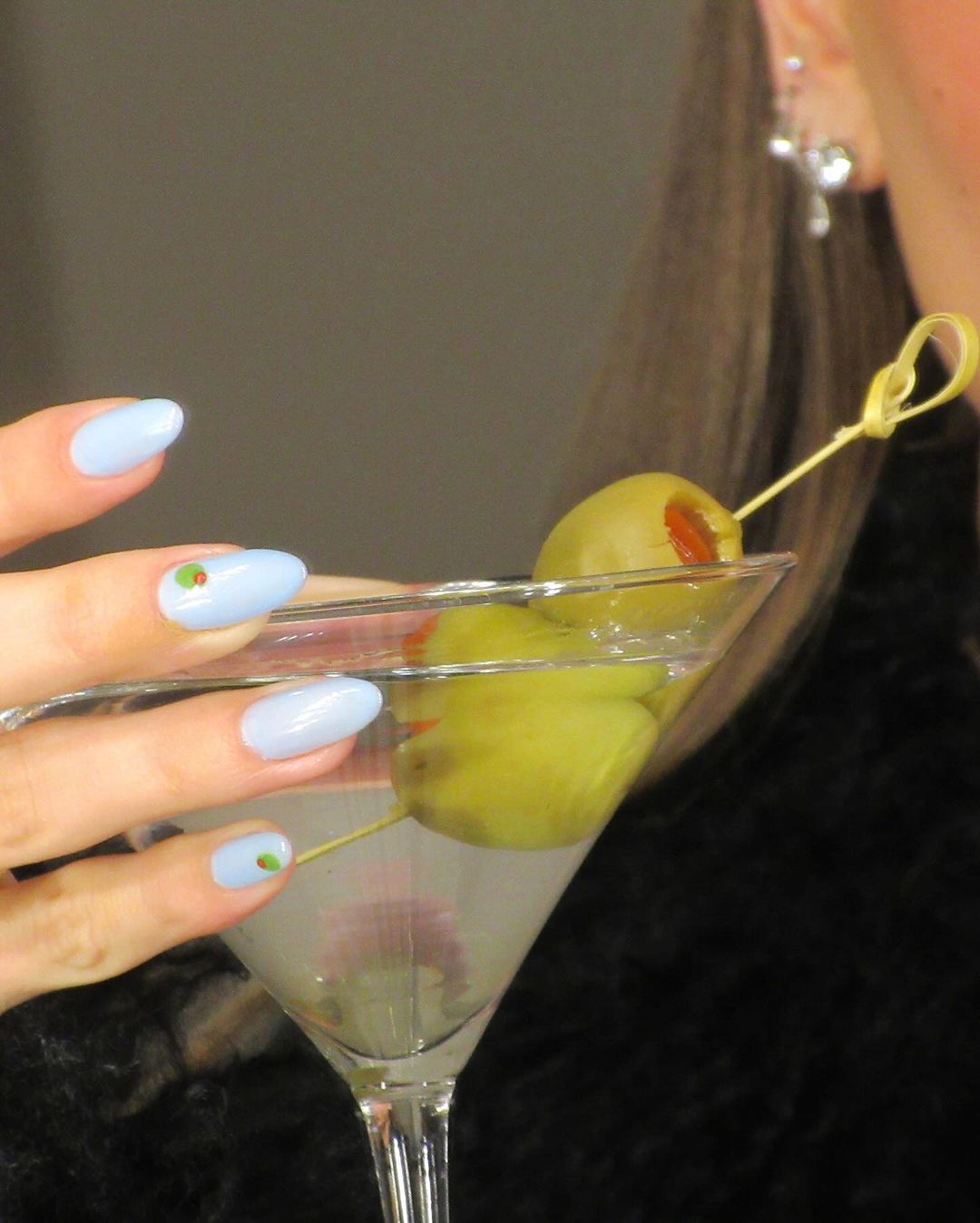 Image may contain Alcohol Beverage Cocktail Adult Person and Martini