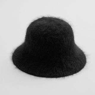 flat lay image of black wool bucket hat 