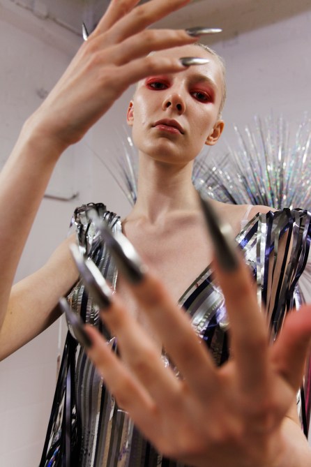 A model with silver chrome nails.