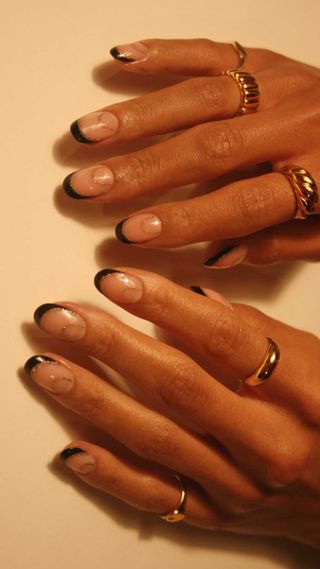 Black and gold french tips nails