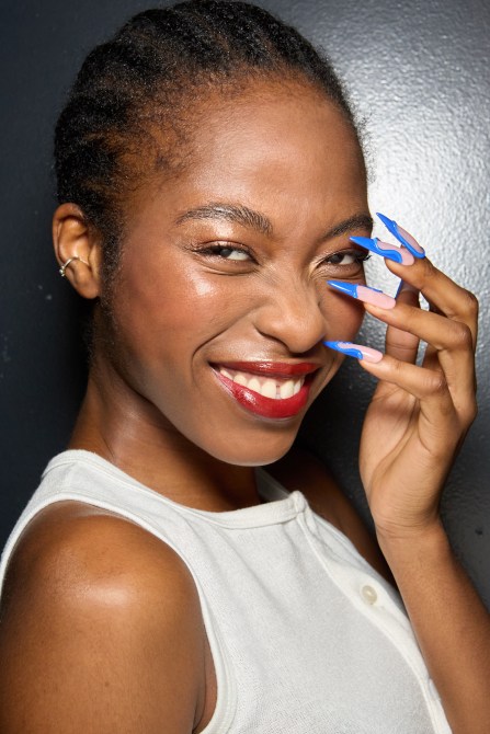 A model with blue french tips.