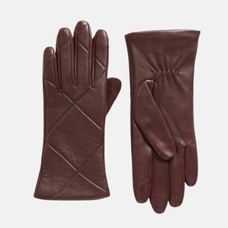 flat lay image of brown leather gloves