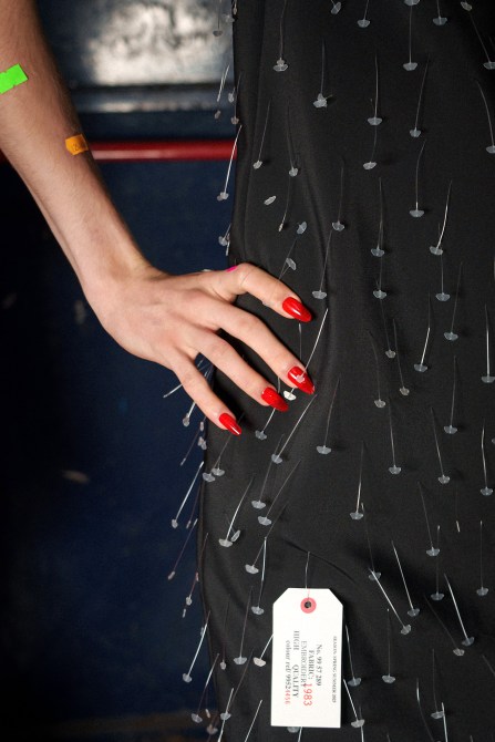 A model wearing red jelly nails.