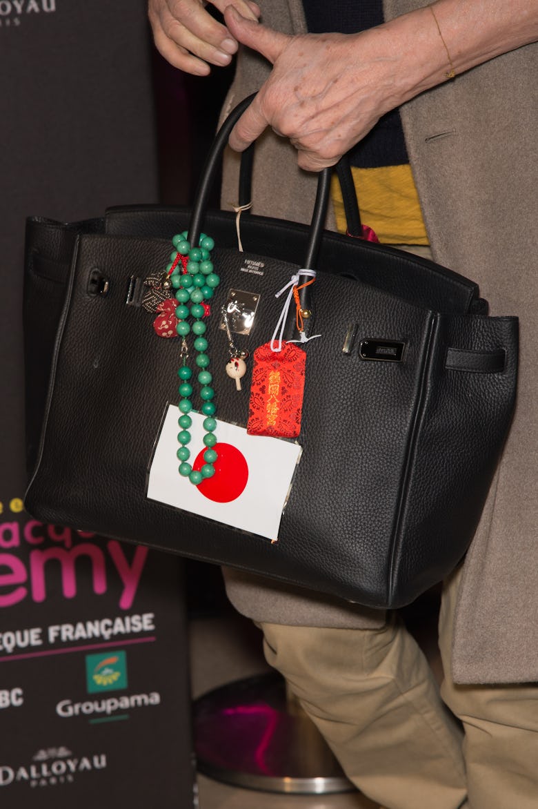 PARIS, FRANCE - APRIL 08:  Jane Birkin (bag detail) attends the 'Le Monde Enchante De Jacques Demy' ...