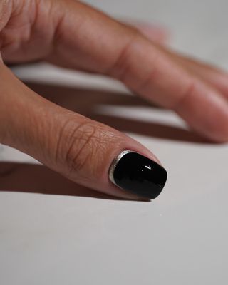 Black and silver reverse french tip nails