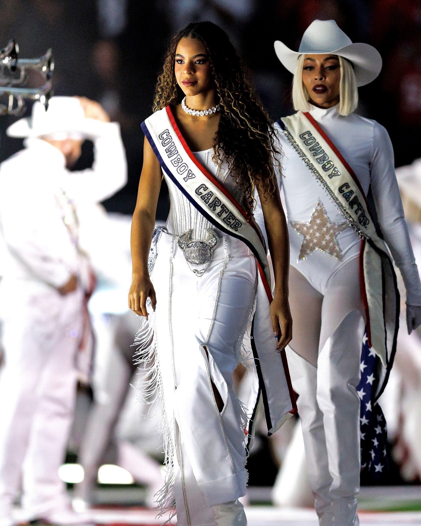 2 Beyonce Wears Custom Roberto Cavalli Couture White Feather Look And An ASN Cowboy Hat While Blue Ivy Wears Custom Frolov Heart And A Stetson Hat To Perform For NFL Halftime On Christmas Day