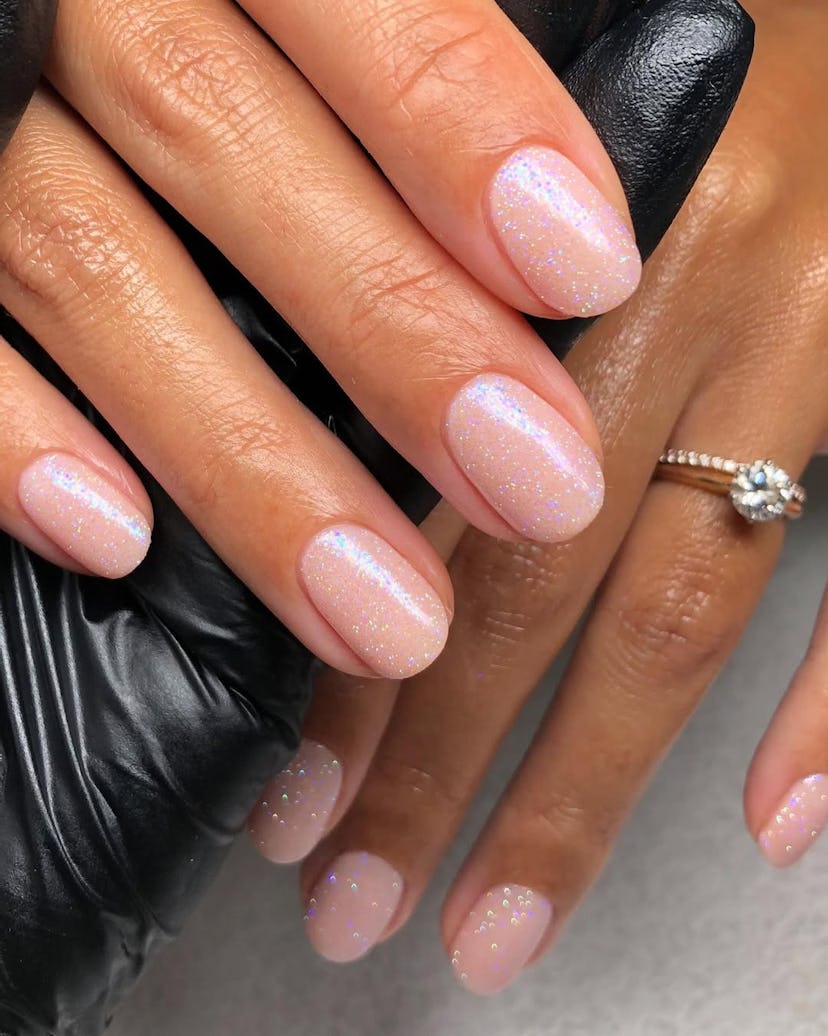 Try mannequin nails with a champagne shimmer for New Year's Eve 2024.