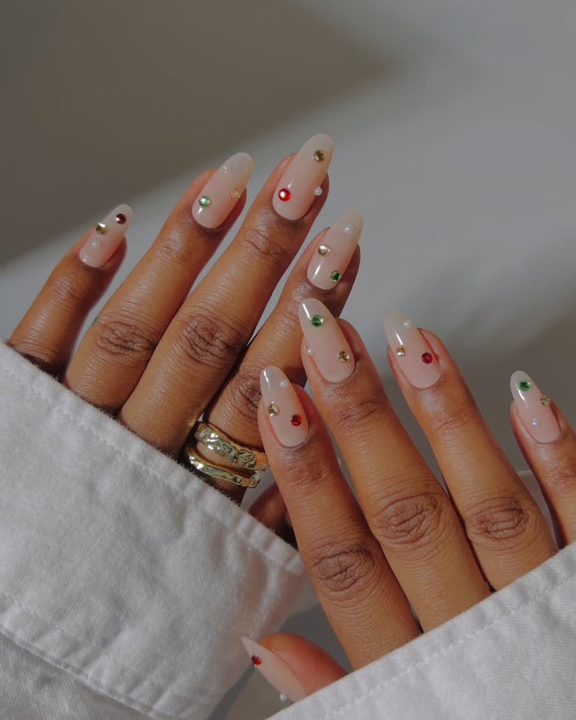 Try minimal nails with colorful rhinestones for New Year's Eve 2024.