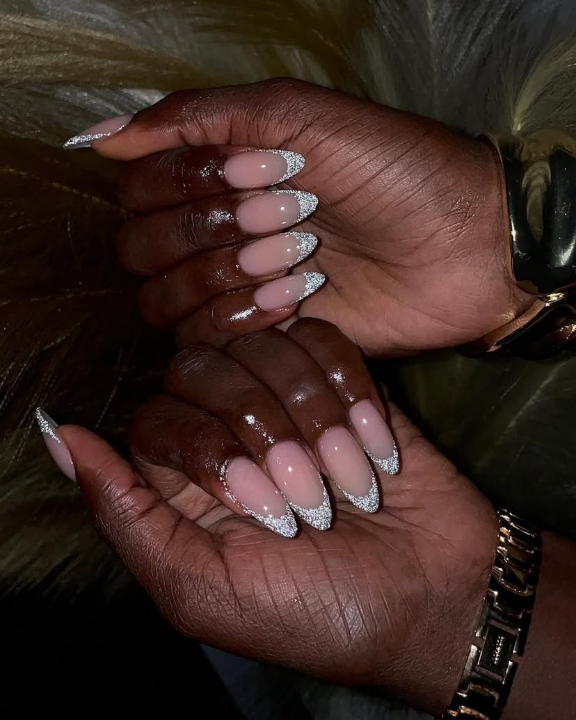 Try glittering French tip nails for New Year's Eve 2024.
