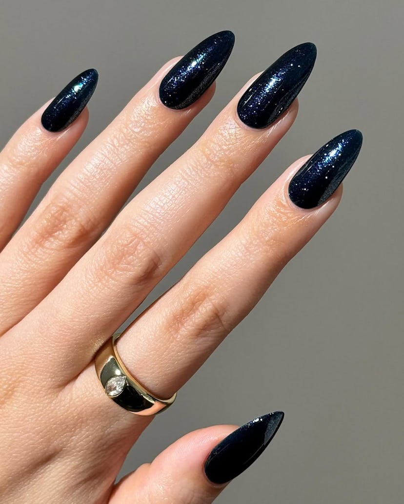 Try sparkling sapphire nails for New Year's Eve 2024.