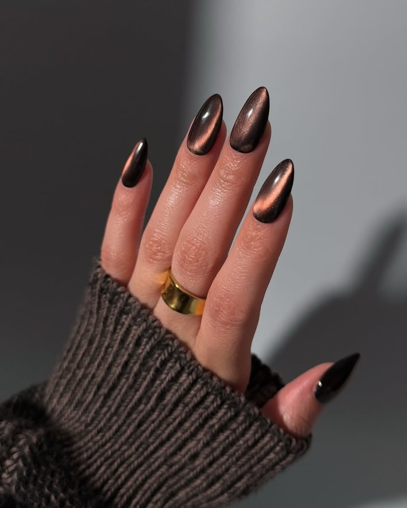 Try chocolate brown glass nails for New Year's Eve 2024.