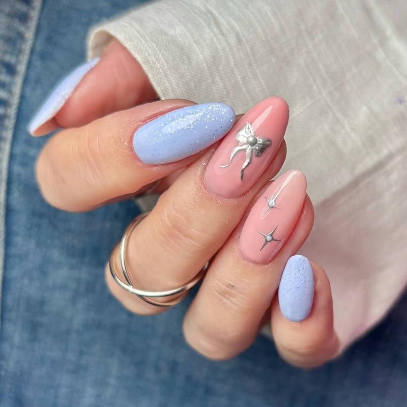 Try baby blue nails with silver ribbon details for New Year's Eve 2024.