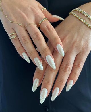 Pearlescent manicure with daisy nail art by Iram Shelton.