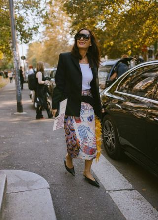 Woman in Milan wearing a statement skirt with feather details