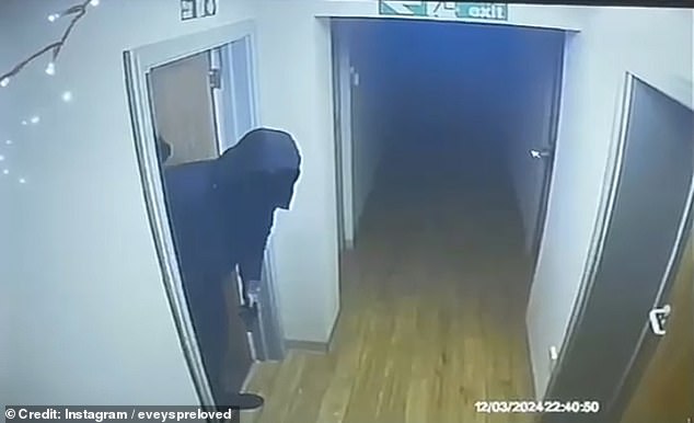 The masked robbers can be seen entering a first door into the corridor and scouring the area