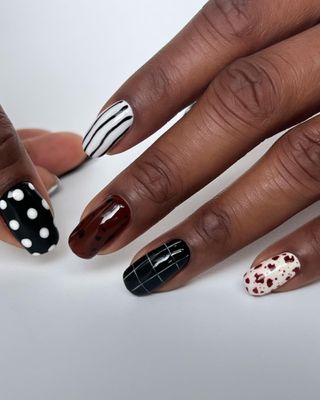 Mixed nail art manicure by Paragaon Beauty LLC.