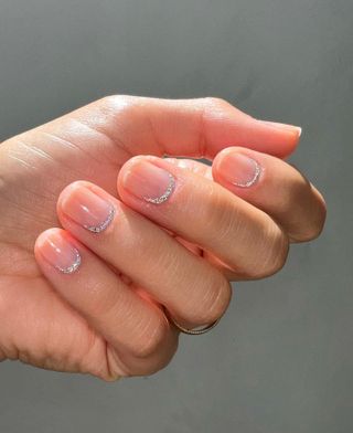 @betina_goldstein silver sparkly reverse French tip nails