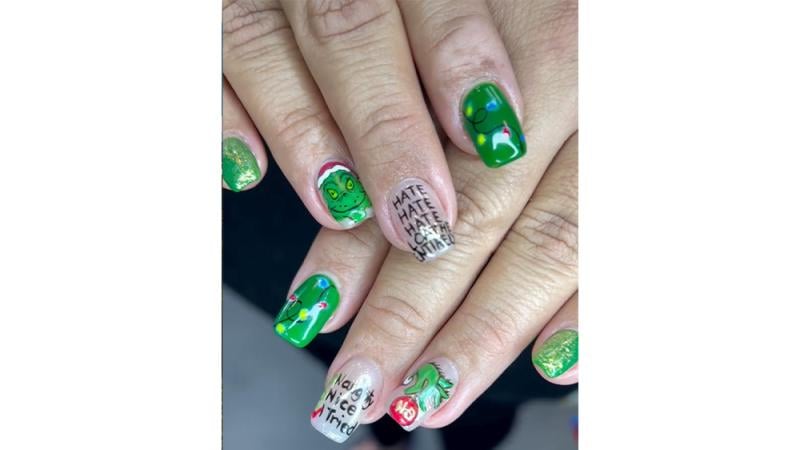 @crystalized.nails character holiday nails