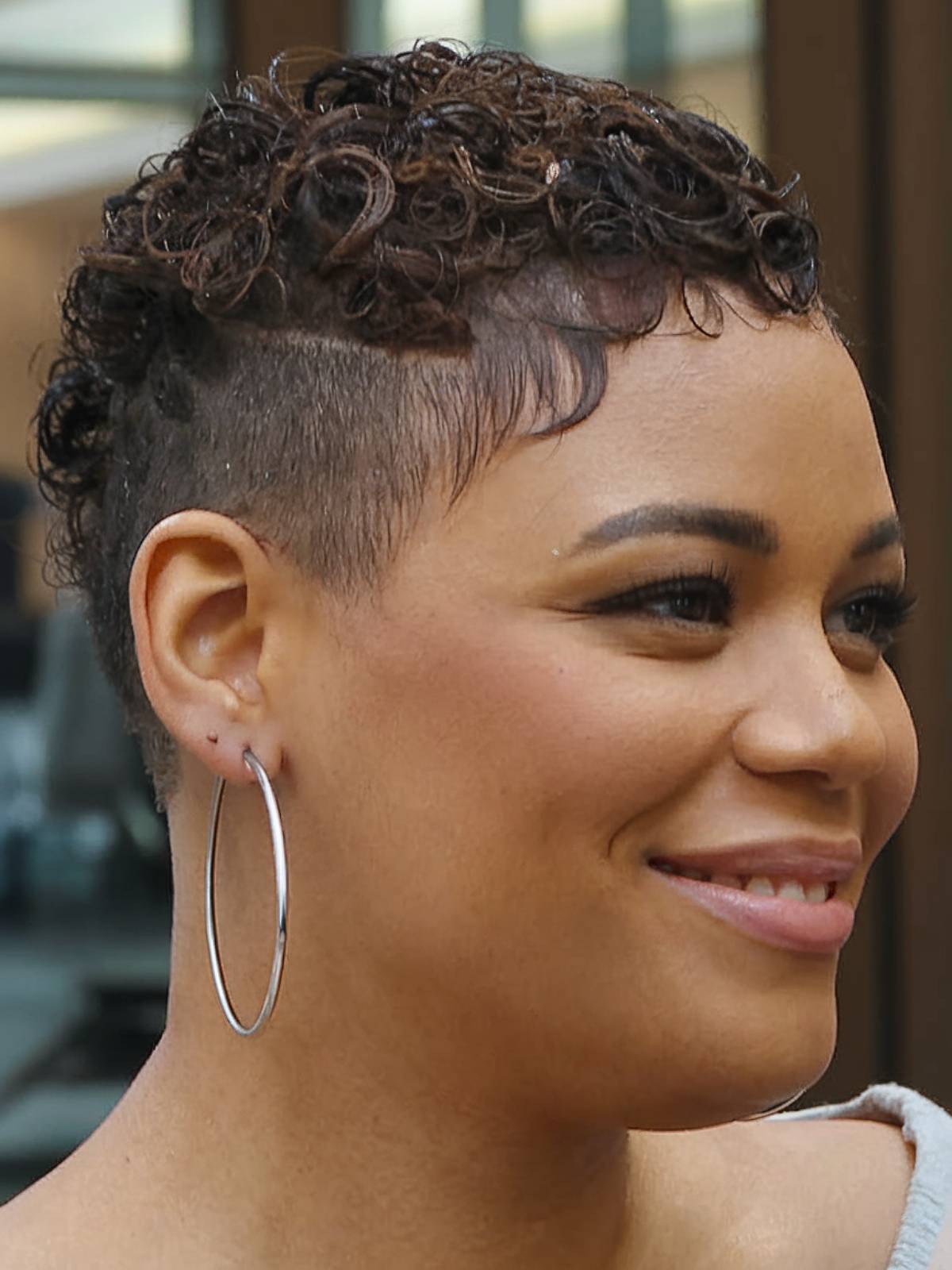 Short undercut with curls for round faces