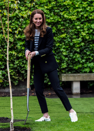 Prince William, Duke of Cambridge and Catherine, Duchess of Cambridge take part in planting a tree during a visit to the University of St Andrews on May 26, 2021 in St Andrews, Scotland