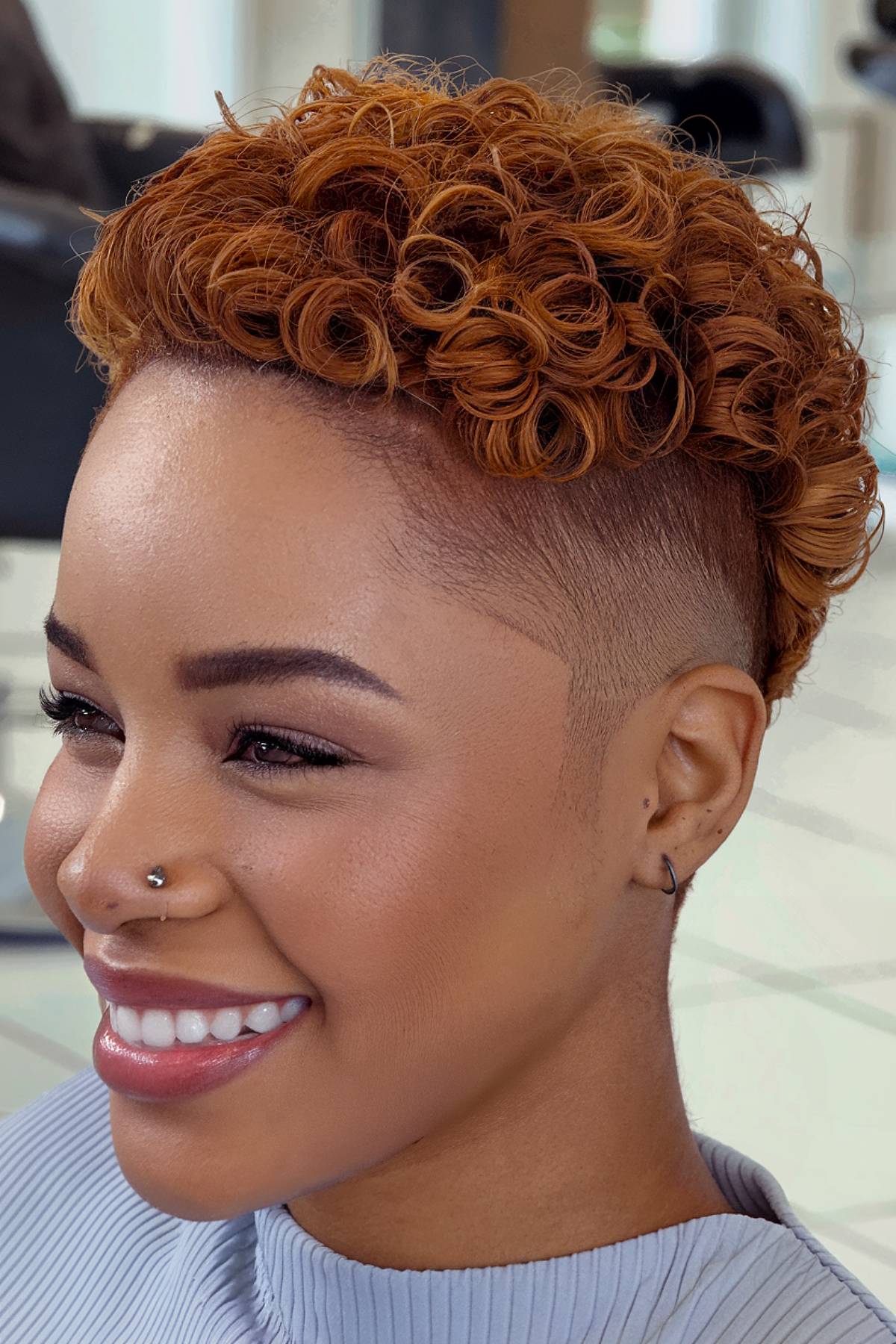 Shaved sides undercut with coiled curls for natural hair