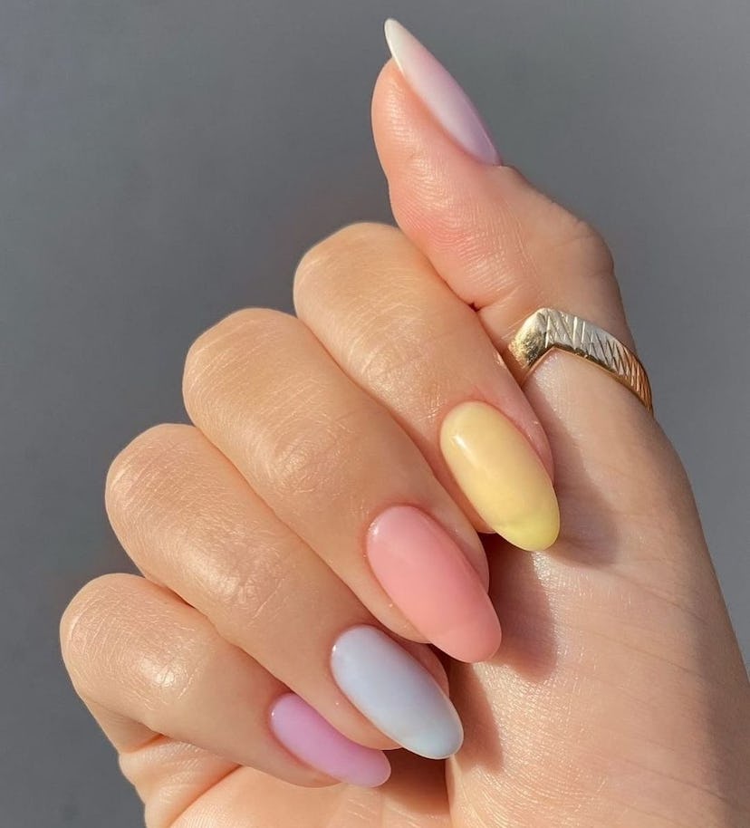 Pastel Skittle nails match the 1960s aesthetic.