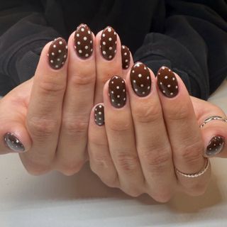 brown nails with white polka dots