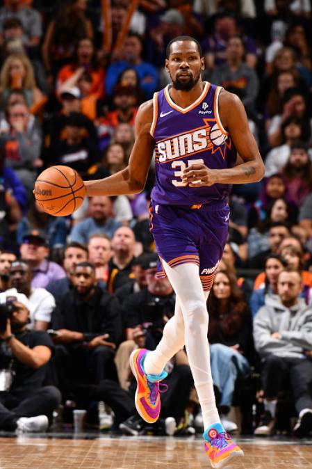 PHOENIX, AZ - APRIL 7: Kevin Durant #35 of the Phoenix Suns dribbles the ball during the game against the New Orleans Pelicans on April 7, 2024 at Footprint Center in Phoenix, Arizona. NOTE TO USER: User expressly acknowledges and agrees that, by downloading and or using this photograph, user is consenting to the terms and conditions of the Getty Images License Agreement. Mandatory Copyright Notice: Copyright 2024 NBAE (Photo by Barry Gossage/NBAE via Getty Images