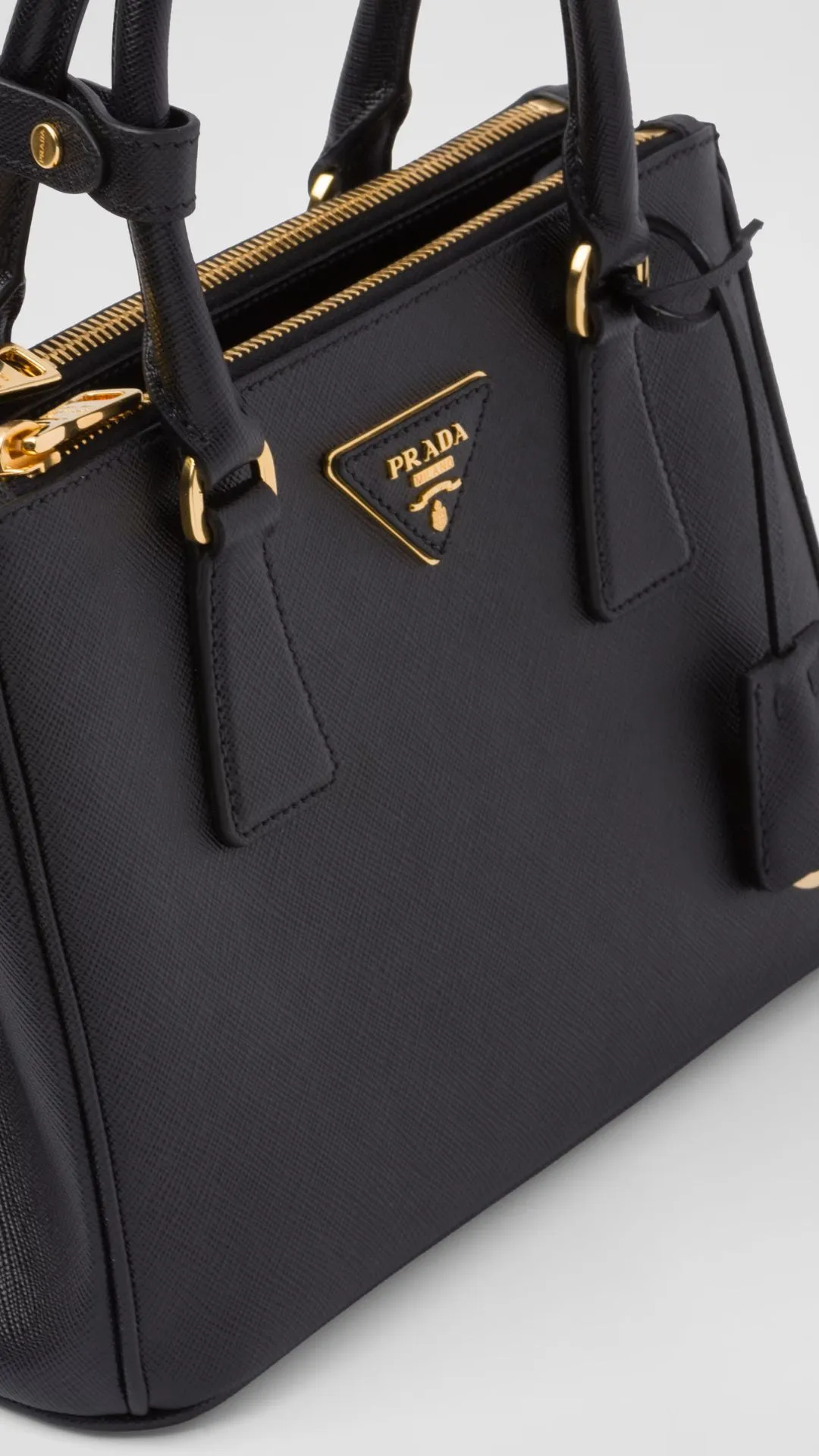 Prada Galleria Saffiano Leather Bag is a timeless classic, made from scratch-resistant Saffiano leather with a structured silhouette and minimalist elegance.