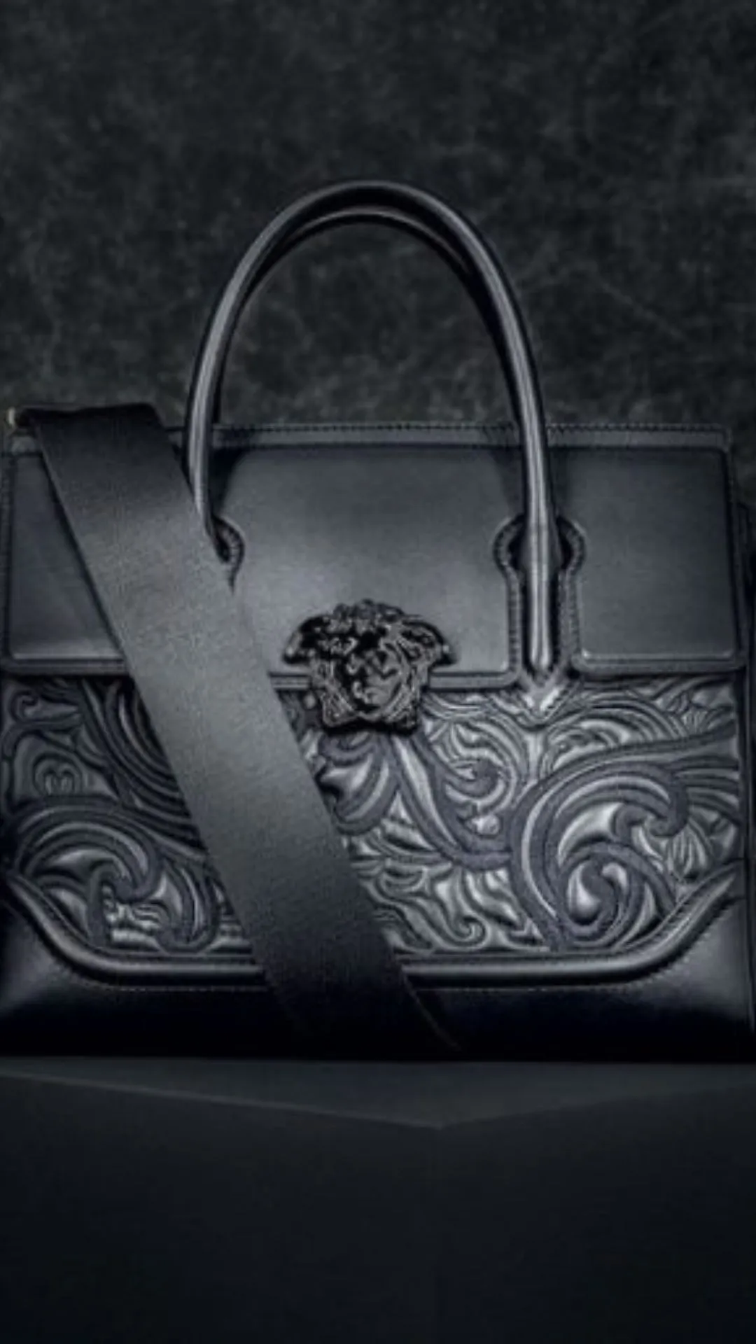 Versace Palazzo Empire Bag is a structured masterpiece that blends contemporary and classical elements with a dramatic Medusa accent.