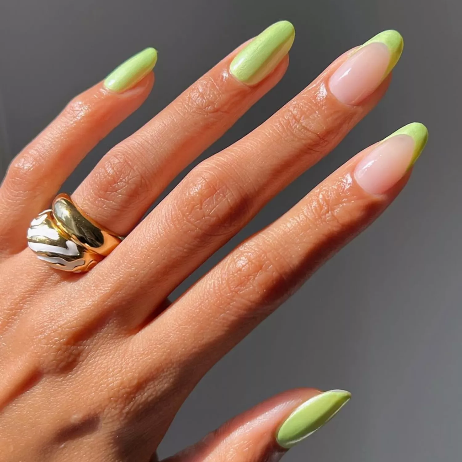Manicure with iridescent pastel lime nails and French tips