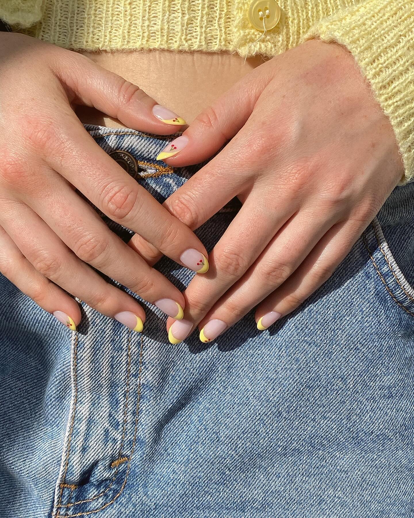 @matejanova yellow French tip nails with cherry nail art