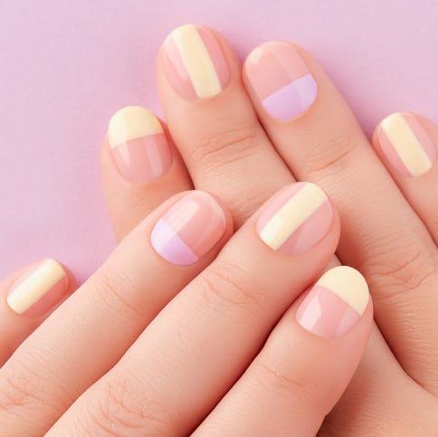 beautiful females hands with manicure on lilac background trendy minimal spring summer nail design