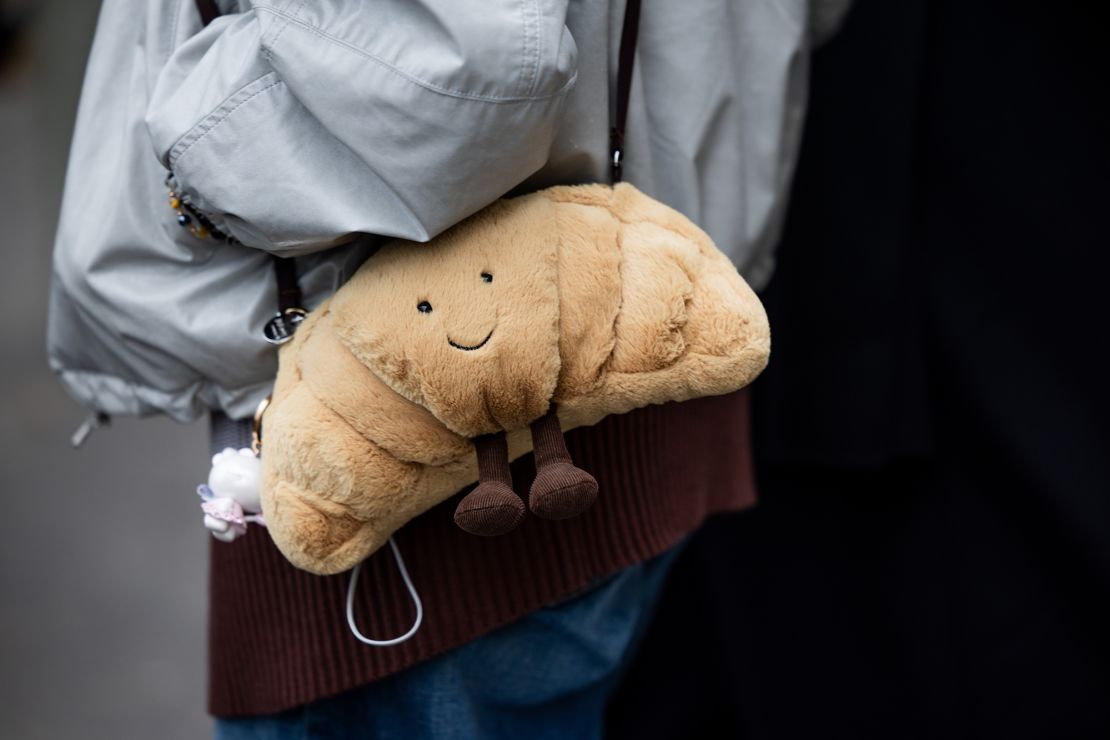 A Jellycat croissant bag is seen during Paris Fashion Week outside Jacquemus earlier this year.